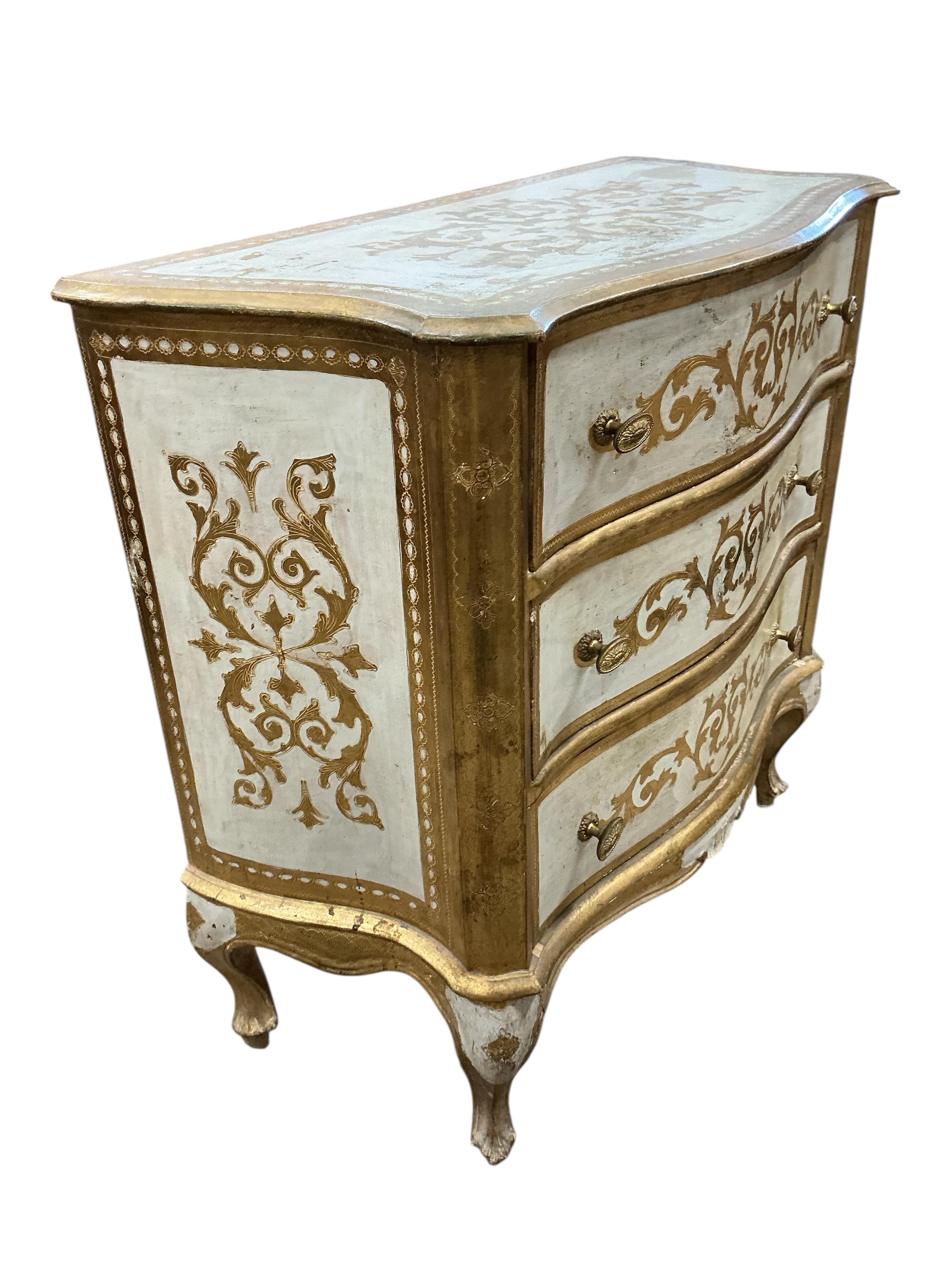 A pair of Northern Italian parcelgilt serpentine three drawer bedside chests, width 69cm, depth 38cm, height 78cm